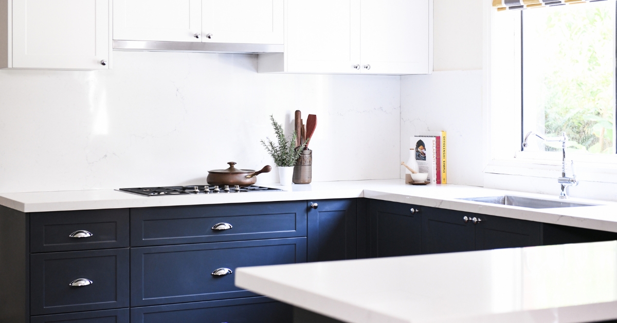 Misterio stone benchtops with blue shaker style cabinetry